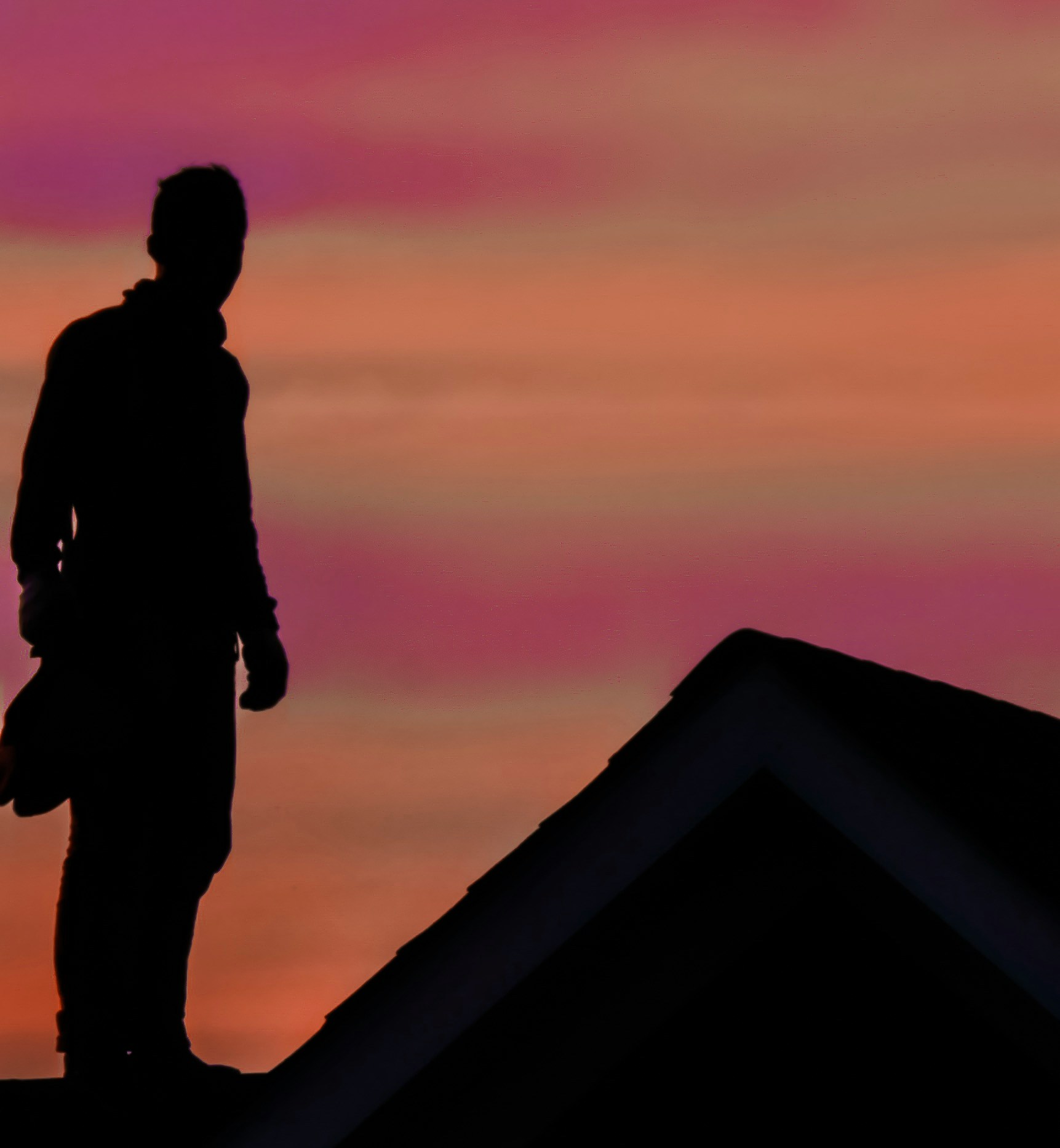 Roofer at sunset